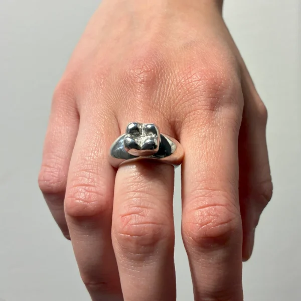 Baby Tooth ring in bronze, worn on hand