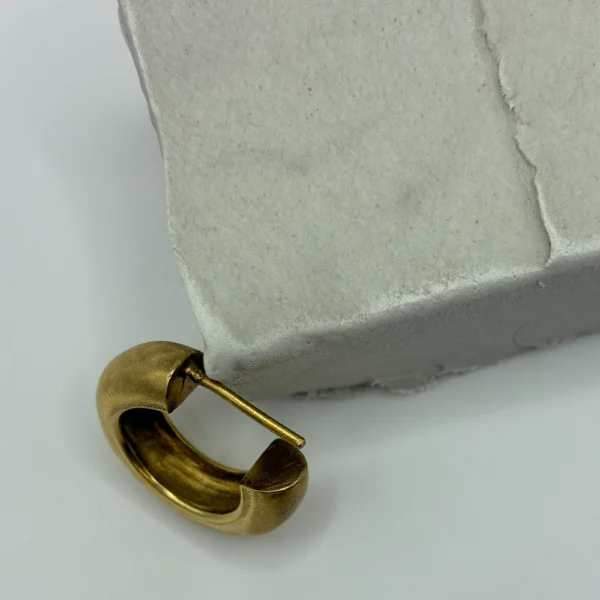 Close-up of Hear Ring bronze earring