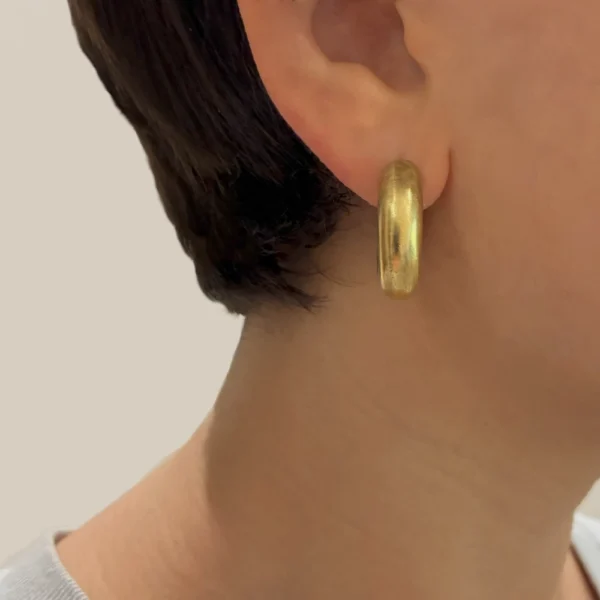 Hear Ring bronze earring worn on ear