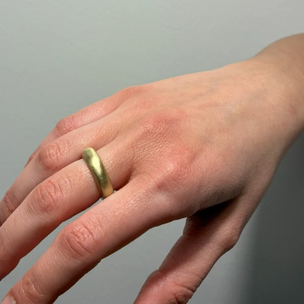 Round Thing ring in bronze, worn on hand