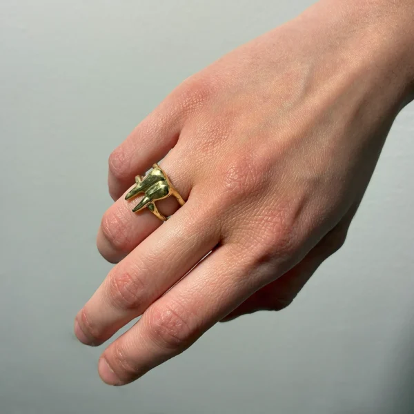 The Braced One bronze ring, worn on hand